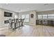 Basement entertaining space features custom bar, dart board, and wood-look flooring at 605 St. Charles Pl, Fayetteville, GA 30215