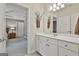 En-suite bathroom with ample vanity storage and a glimpse into the bedroom space at 605 St. Charles Pl, Fayetteville, GA 30215