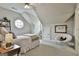 Charming bedroom with soft lighting, comfortable bed and a unique octagonal window at 605 St. Charles Pl, Fayetteville, GA 30215