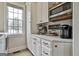 This space features quartz countertops, microwave, and ample storage for appliances at 605 St. Charles Pl, Fayetteville, GA 30215