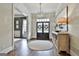 Bright foyer with a chandelier, decor, and a glimpse of the double-door entryway at 605 St. Charles Pl, Fayetteville, GA 30215