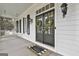 Elegant front door with glass panels, adorned with wreaths, and a charming welcome mat at 605 St. Charles Pl, Fayetteville, GA 30215