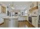 Spacious kitchen with white cabinets, an island, stainless steel appliances, and an open floor plan at 605 St. Charles Pl, Fayetteville, GA 30215