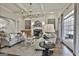 Inviting living room with a fireplace, coffered ceiling, and comfortable seating at 605 St. Charles Pl, Fayetteville, GA 30215