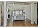 Bright living room boasts a coffered ceiling, stone fireplace, and large windows at 605 St. Charles Pl, Fayetteville, GA 30215