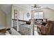 Cozy living room with hardwood floors, ceiling fan and comfortable seating arrangement at 605 St. Charles Pl, Fayetteville, GA 30215