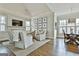 Inviting sitting room features a fireplace, vaulted ceiling, and comfortable seating at 605 St. Charles Pl, Fayetteville, GA 30215