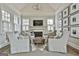Cozy sitting room with a fireplace, vaulted ceiling, and plenty of natural light at 605 St. Charles Pl, Fayetteville, GA 30215
