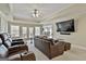 Finished basement theater featuring recliner seating and a large screen TV at 605 St. Charles Pl, Fayetteville, GA 30215