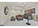 Basement theater room with comfy leather seating and a large TV for entertainment at 605 St. Charles Pl, Fayetteville, GA 30215