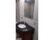 Bathroom featuring a vanity with a dark countertop, waiting for finishing touches to complete the renovation at 4571 Scarborough Rd, South Fulton, GA 30349