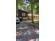 Charming home with a brick and siding exterior, set back from the street with mature trees at 4571 Scarborough Rd, South Fulton, GA 30349