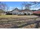 Wide view of the home's backyard, showing the deck and ample green space at 3434 Estels Ln, Conyers, GA 30013