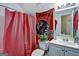 Charming bathroom with shower/tub combo, bright vanity, and decorative mirror at 3434 Estels Ln, Conyers, GA 30013