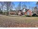 Classic brick home on a spacious lot, showcasing the property's curb appeal at 3434 Estels Ln, Conyers, GA 30013