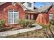 Close-up of the brick home's entrance, featuring a well-manicured walkway at 3434 Estels Ln, Conyers, GA 30013