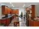 Spacious kitchen with wood cabinets, central island, and stainless steel refrigerator at 3434 Estels Ln, Conyers, GA 30013