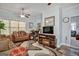 Comfortable living room with ceiling fan, patterned rug, fireplace, and large flat screen TV at 3434 Estels Ln, Conyers, GA 30013