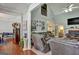 Cozy living room featuring comfortable sofas and a fireplace, perfect for relaxation at 3434 Estels Ln, Conyers, GA 30013