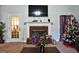Bright living room with brick fireplace, large windows, and a ceiling-mounted TV at 3434 Estels Ln, Conyers, GA 30013