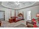 Large main bedroom with tray ceiling and four poster bed at 3434 Estels Ln, Conyers, GA 30013