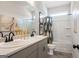 Functional bathroom features double sinks, tile floors, and a tub-shower combination at 10459 Trellis Lane (Lot 27), Hampton, GA 30228