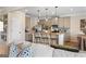 Stylish kitchen with stainless steel appliances, granite countertops, and eat-in island seating at 10459 Trellis Lane (Lot 27), Hampton, GA 30228