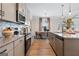 Well-equipped kitchen with stainless steel appliances and granite countertops at 10459 Trellis Lane (Lot 27), Hampton, GA 30228