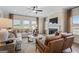 Spacious living room featuring a fireplace and ample natural light at 10459 Trellis Lane (Lot 27), Hampton, GA 30228