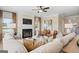 Relaxing living room featuring a fireplace and a large comfortable sectional sofa at 10459 Trellis Lane (Lot 27), Hampton, GA 30228