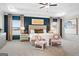 Serene main bedroom with tray ceilings, bedside tables, and a large bed at 10459 Trellis Lane (Lot 27), Hampton, GA 30228