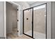 Featuring a large shower with a frameless door, as well as an open doorway to a closet at 10459 Trellis Lane (Lot 27), Hampton, GA 30228