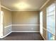 Neutral-toned dining room with carpet, chair rail, and bright windows at 3497 Thornewoode Pointe, Decatur, GA 30034