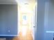 Hallway with wood flooring and white doors leading to various rooms at 3497 Thornewoode Pointe, Decatur, GA 30034