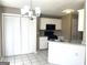 Eat-in kitchen features white cabinets, breakfast bar and tile flooring at 3497 Thornewoode Pointe, Decatur, GA 30034