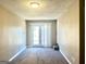 Living room featuring neutral paint, patio doors with blinds, and grey carpet at 3497 Thornewoode Pointe, Decatur, GA 30034