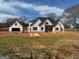 Unfinished single-Gathering home featuring a two-car garage on a sprawling lawn at 470 Snead Road # 1, Fayetteville, GA 30215