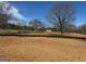 Photo showcasing land available to be built on, with an expansive lawn and mature trees in the background at 462 Snead Road # 2, Fayetteville, GA 30215