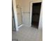 Bathroom with tiled floors, a shower, and a walk-in closet at 10467 Tara Beach Cir, Jonesboro, GA 30238