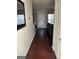Inviting hallway with hardwood floors, leading to the living area and back door at 10467 Tara Beach Cir, Jonesboro, GA 30238