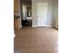 Kitchen area featuring tile floors and ample counter space at 10467 Tara Beach Cir, Jonesboro, GA 30238
