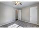 Bedroom featuring gray carpet, neutral walls, ceiling fan and a window at 5495 Reynolds Rd, Morrow, GA 30260