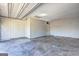 This is an image of a spacious and empty two-car garage with white walls and doors at 5495 Reynolds Rd, Morrow, GA 30260