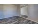 Open living space featuring stylish gray wood-look flooring and neutral paint at 5495 Reynolds Rd, Morrow, GA 30260