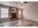 Bright living room boasts a stone fireplace, large window, and a door to the outside at 5495 Reynolds Rd, Morrow, GA 30260