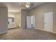 Main bedroom with bathroom, ceiling fan, and neutral paint at 5495 Reynolds Rd, Morrow, GA 30260