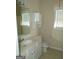Bathroom featuring a white vanity, toilet, and a bright window at 358 Southgate Dr, Locust Grove, GA 30248