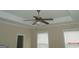 Bedroom featuring a ceiling fan with attached lighting and two bright windows at 358 Southgate Dr, Locust Grove, GA 30248