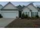 Charming one-story home with a two-car garage and well-maintained landscaping at 358 Southgate Dr, Locust Grove, GA 30248