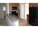 Open kitchen with bar seating, stainless steel sink, and access to adjacent rooms at 358 Southgate Dr, Locust Grove, GA 30248